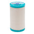 Spool of Coats cotton-covered thread with teal lid on a white background