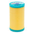 Spool of yellow thread with a blue lid on a white background