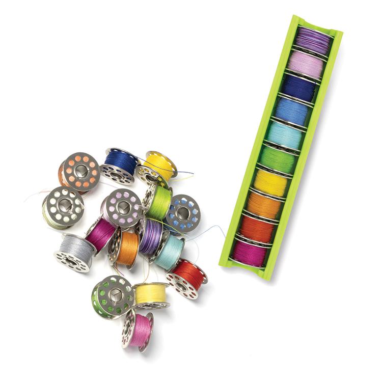 Colorful thread spools on a white background