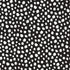 A repeating black-and-white spotted pattern with irregular white dots on a black background, shown as a full-frame pattern swatch.