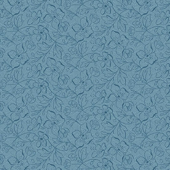 A close-up of a blue fabric featuring a repeating floral vine design in a slightly darker blue tone.