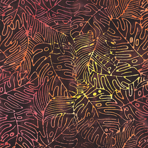 Patterned fabric with abstract designs in orange, yellow, and red on a dark background