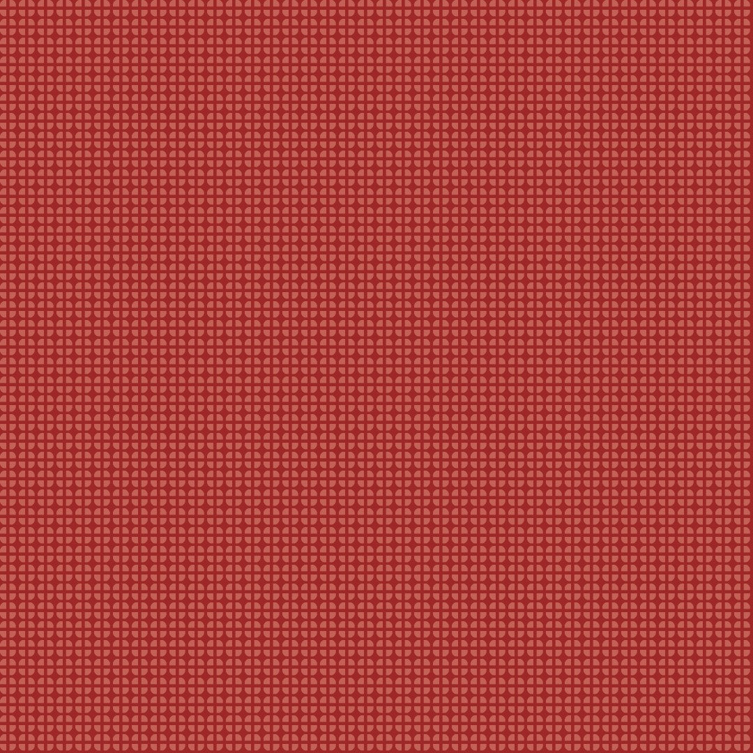 A close-up of a red textured material with a fine repeating geometric pattern.