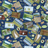 A repeating pattern of vintage-style travel postcards and stamps on a dark blue background, featuring camping, hiking, and outdoor scenes with bears, trees, lakes, and text such as 'Big Sky Country' and 'Travel'.
