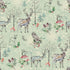Patterned fabric with deer, owls, and forest elements on a light green background