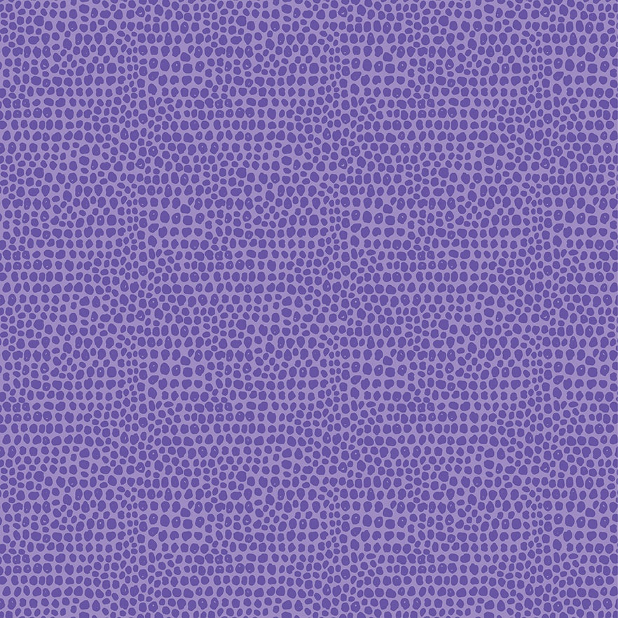 A close-up of a purple fabric or material swatch with an allover dotted pattern in slightly darker purple.