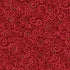 Red patterned fabric with swirling designs on a red background