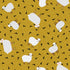 A repeating pattern of stylized white sheep with pink faces and brown legs on a mustard yellow background with small black bird silhouettes.