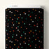 Black fabric with colorful star pattern on a white background