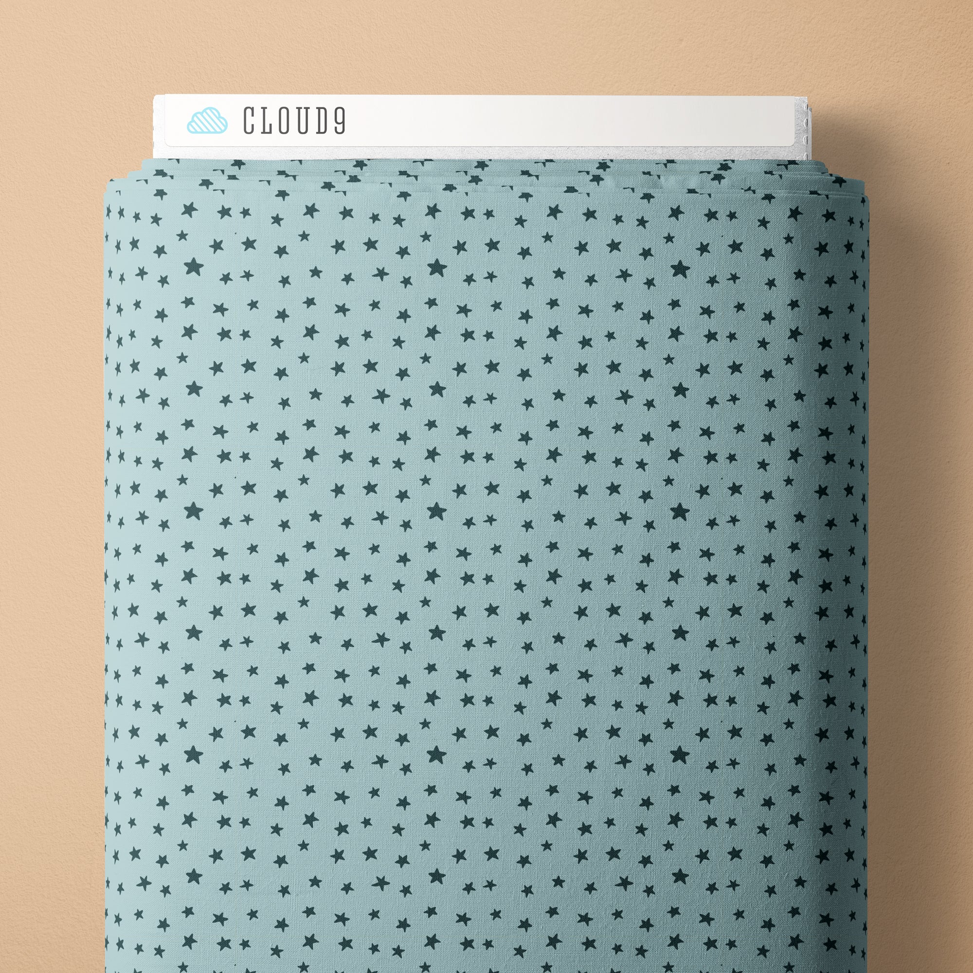 Blue fabric with star pattern and 'Cloud9' branding on a beige background