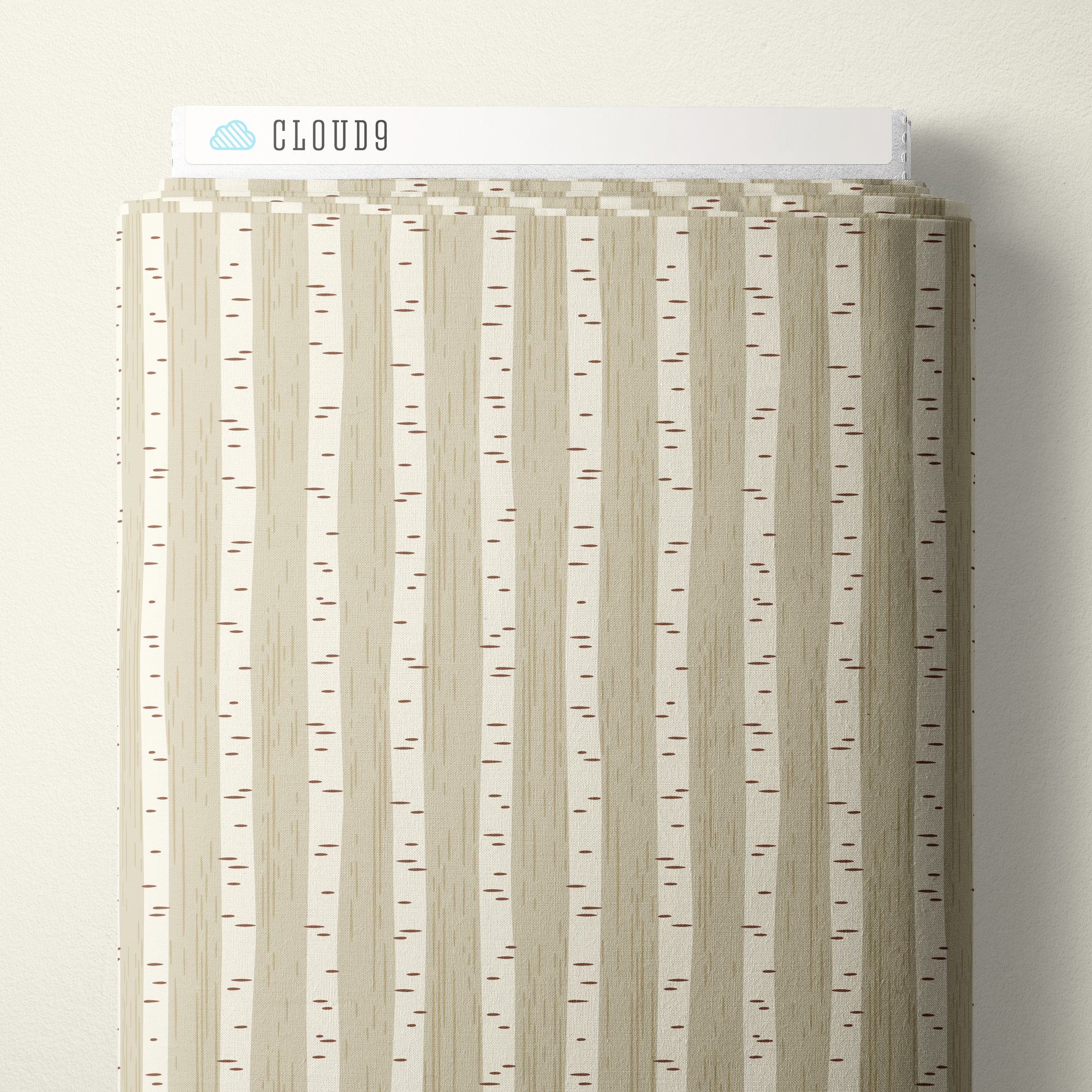 A vertical sample card of Cloud9 fabric featuring a vertical birch tree bark pattern in beige, cream, and light brown with tiny red accents, shown against a neutral off-white background.