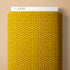Mustard yellow fabric with star pattern and 'Cloud9' branding on a beige background