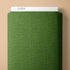 Green fabric with a subtle pattern on a beige background, featuring the brand 'Cloud9'.