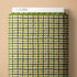 Plaid-patterned product with 'Cloud9' branding on a beige background