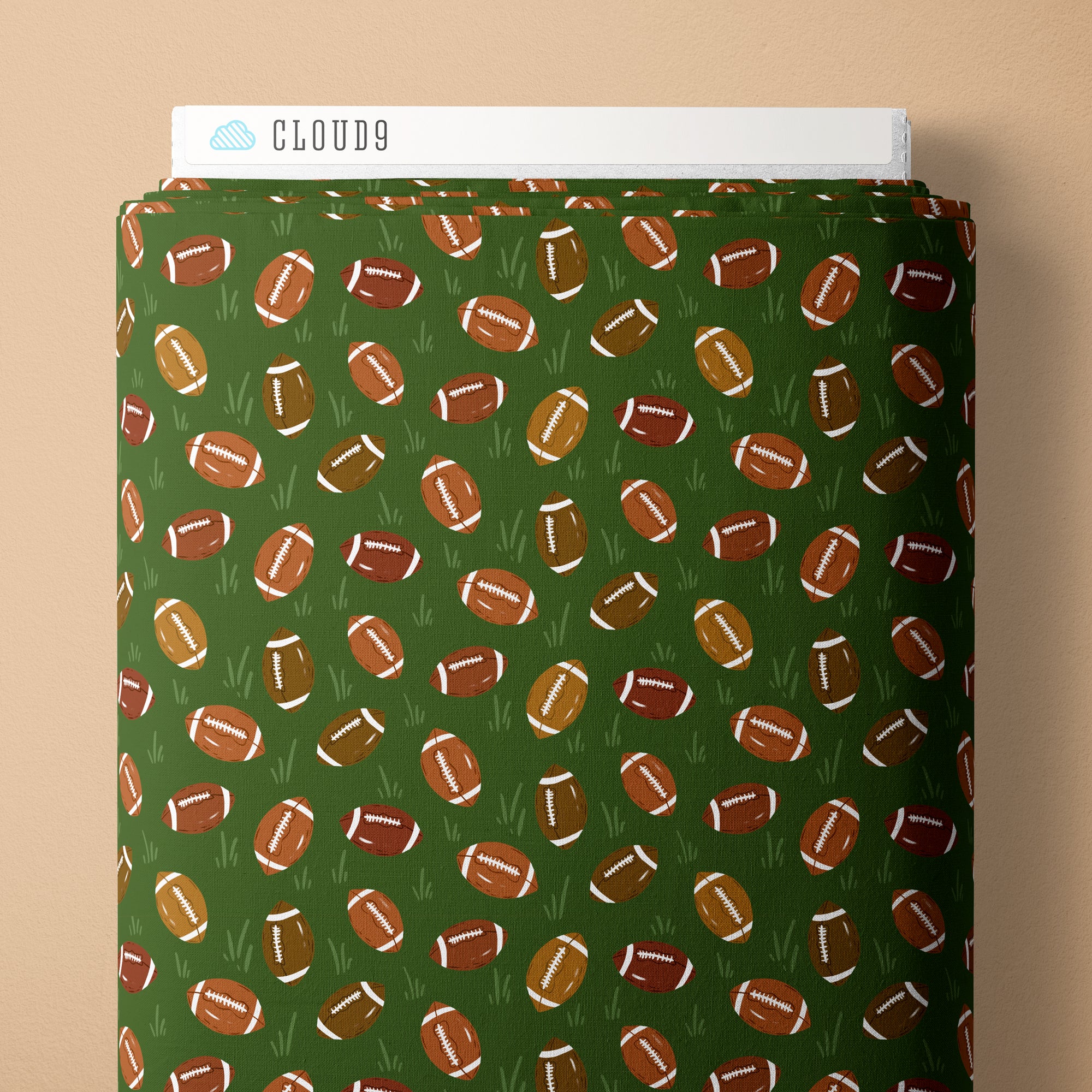 Green fabric with football pattern and Cloud9 branding on a beige background