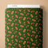 Green fabric with football pattern and Cloud9 branding on a beige background