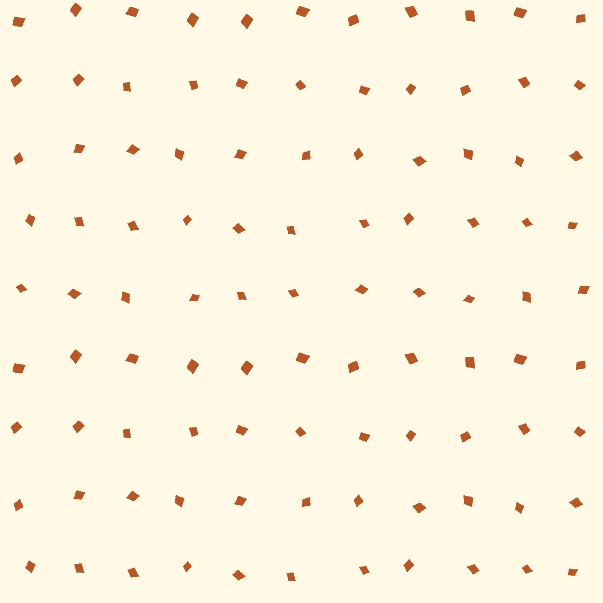 A repeating pattern of small brown irregular geometric shapes scattered across a warm cream background.