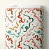 Textile with colorful ribbon pattern on a white background, branded 'Cloud9'.