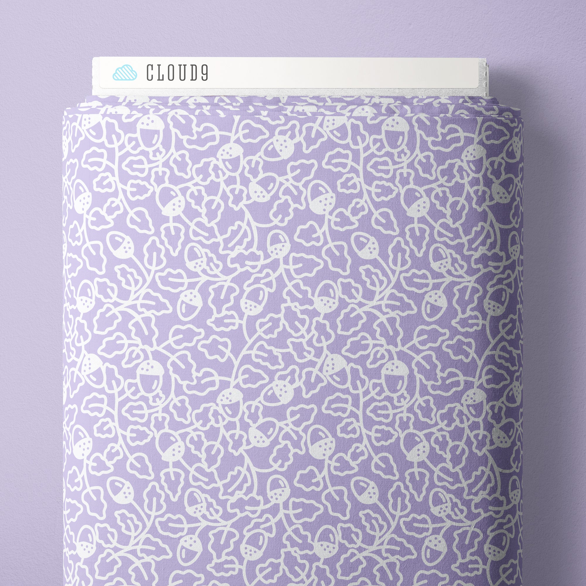 A roll of lavender purple fabric with a white line-art pattern of acorns and leaves, shown with a white header card labeled CLOUD9 at the top against a matching lavender background.