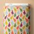 Fabric roll with colorful foam finger patterns and text on a beige background