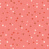 Fabric with red, white, and brown stars on a pink background