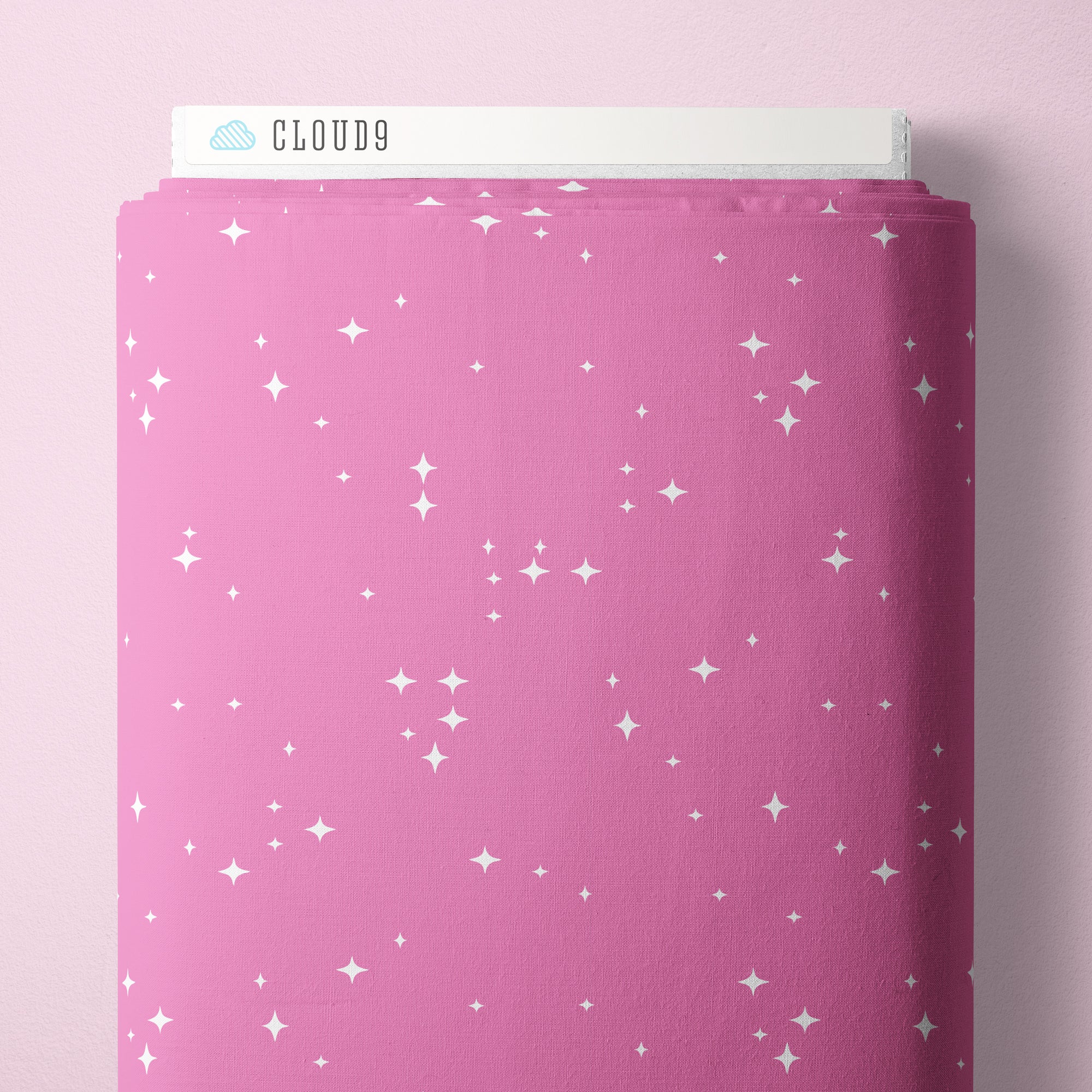 Pink fabric with star pattern and 'Cloud9' branding on a pink background