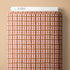 Plaid-patterned product with 'Cloud9' branding on a beige background