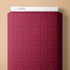 Folded fabric with star pattern on a beige background, branded 'Cloud9'.