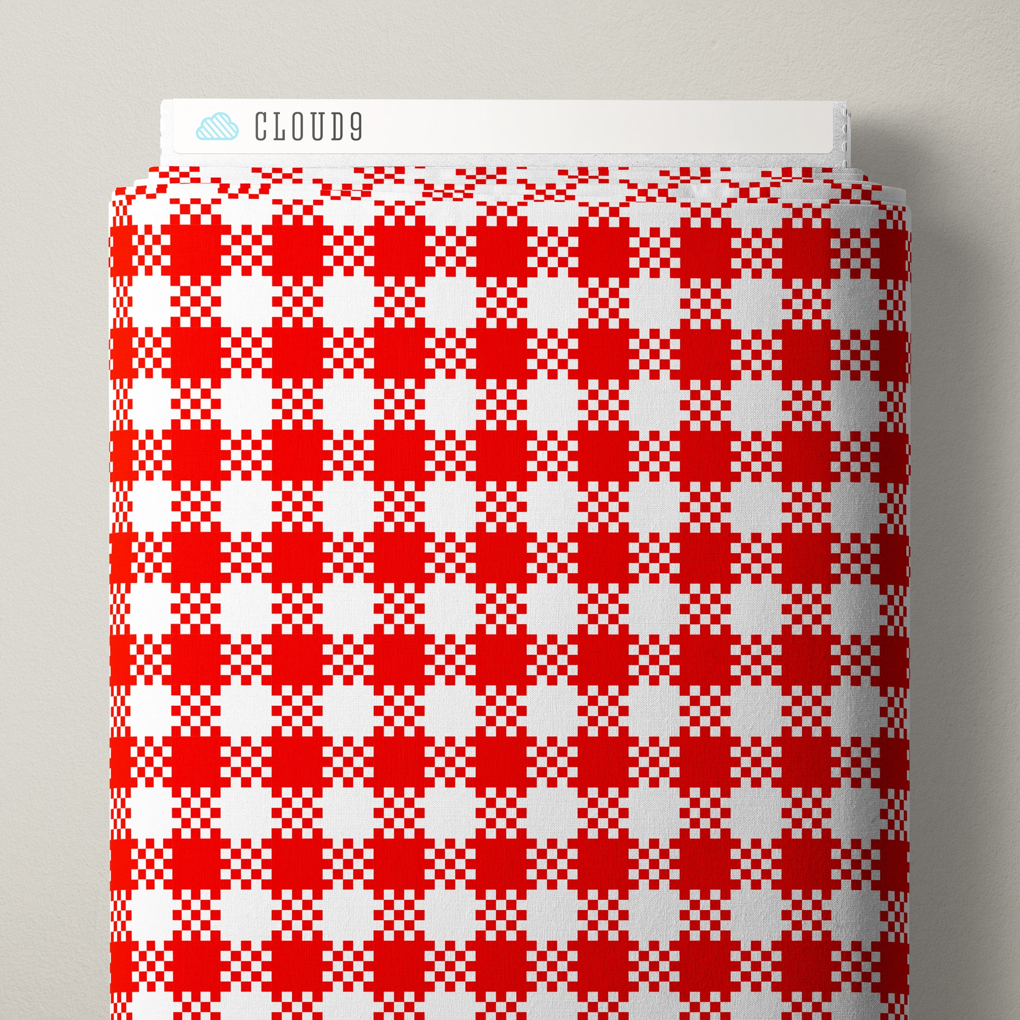 Red and white gingham patterned fabric roll with a white header card labeled CLOUD9 at the top, photographed against a light gray background.