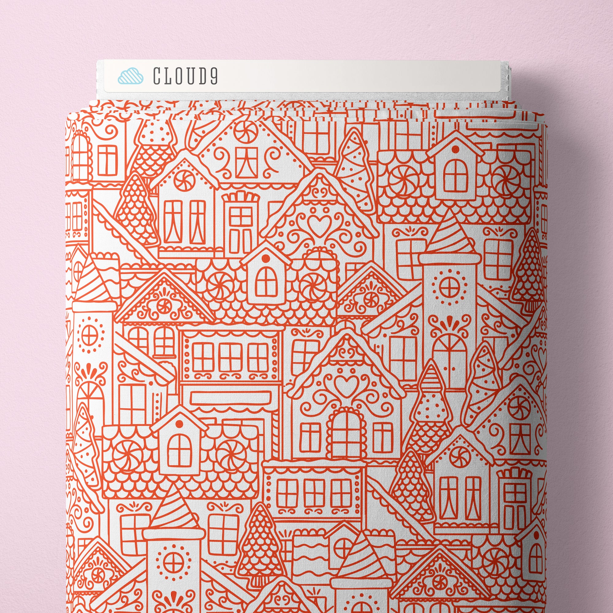 Fabric bolt with house pattern on a pink background