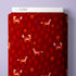 A roll of fabric with a festive red background, featuring a repeating pattern of orange foxes, red pine trees, and small orange mushrooms. The brand name 'CLOUD9' is visible on the white paper header at the top of the roll.