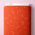 Red fabric bolt with white star pattern on a pink background, branded 'Cloud9'.