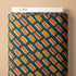 Fabric with hot dog pattern on a beige background