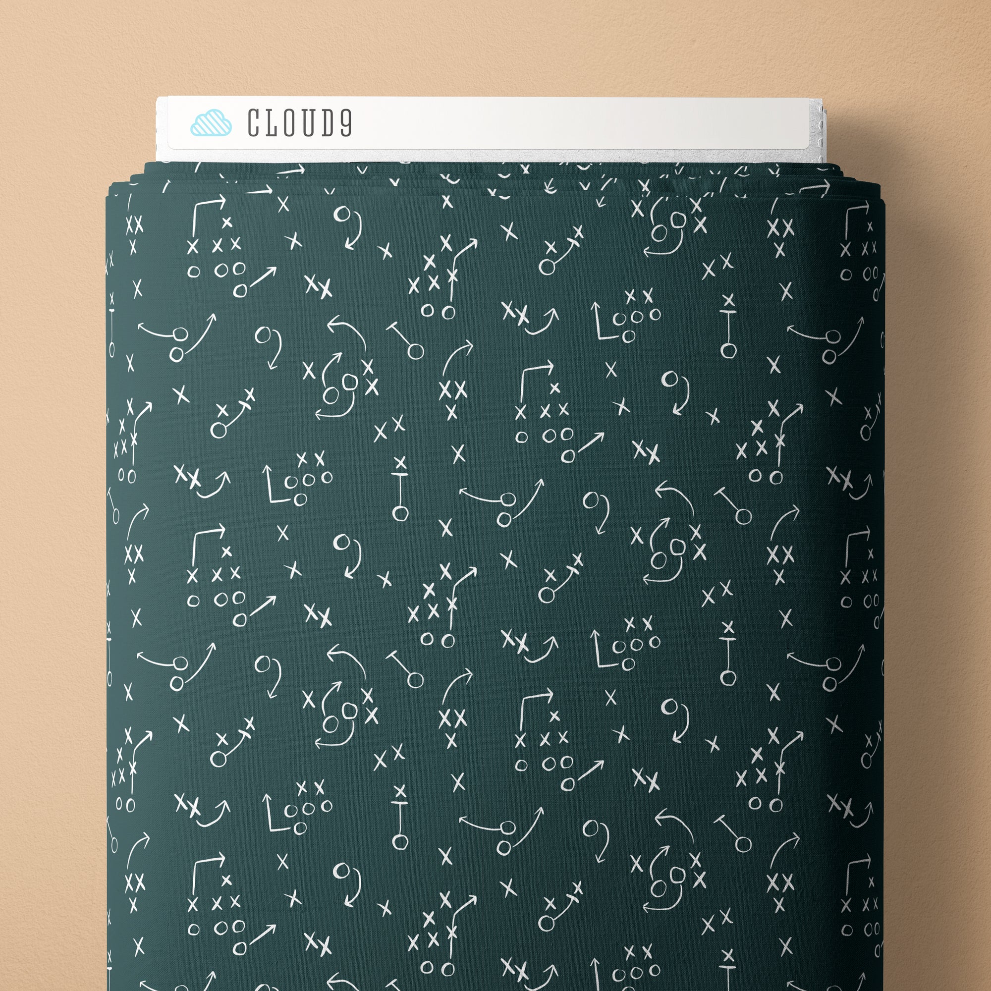 Dark green fabric with white football play patterns and 'Cloud9' branding on a beige background