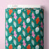Fabric bolt with Christmas ornament pattern on a pink background