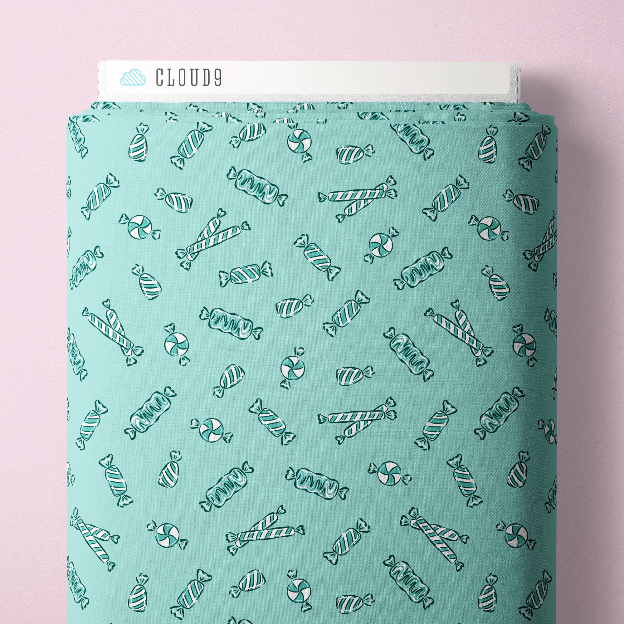 Teal-patterned fabric packaging with 'Cloud9' branding on a pink background