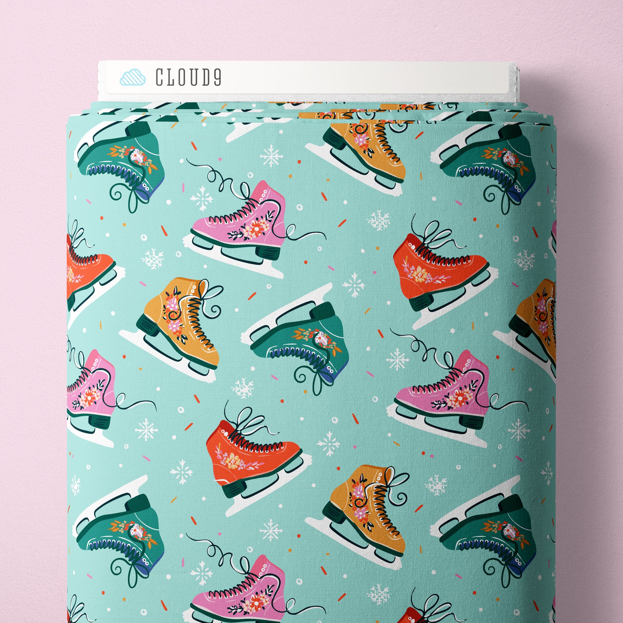 Fabric with colorful ice skates pattern on a light blue background, branded 'Cloud9'.