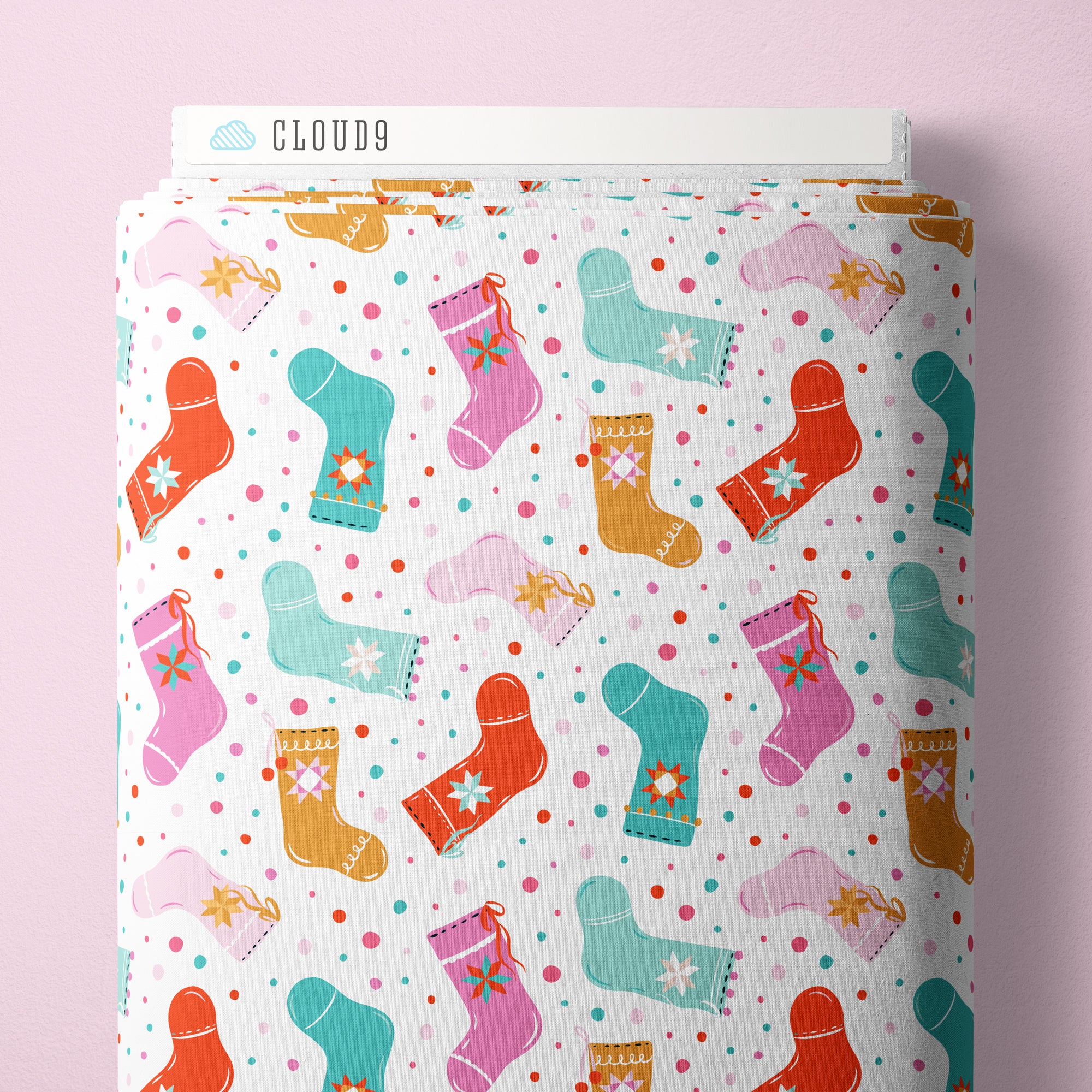 Fabric bolt with colorful sock design on a pink background