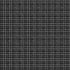 A close-up of a black fabric with a white hand-drawn grid pattern.