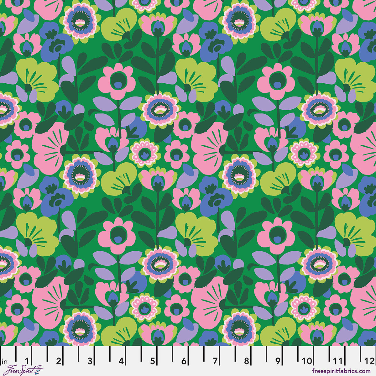 Colorful floral pattern on a green background with a ruler at the bottom.