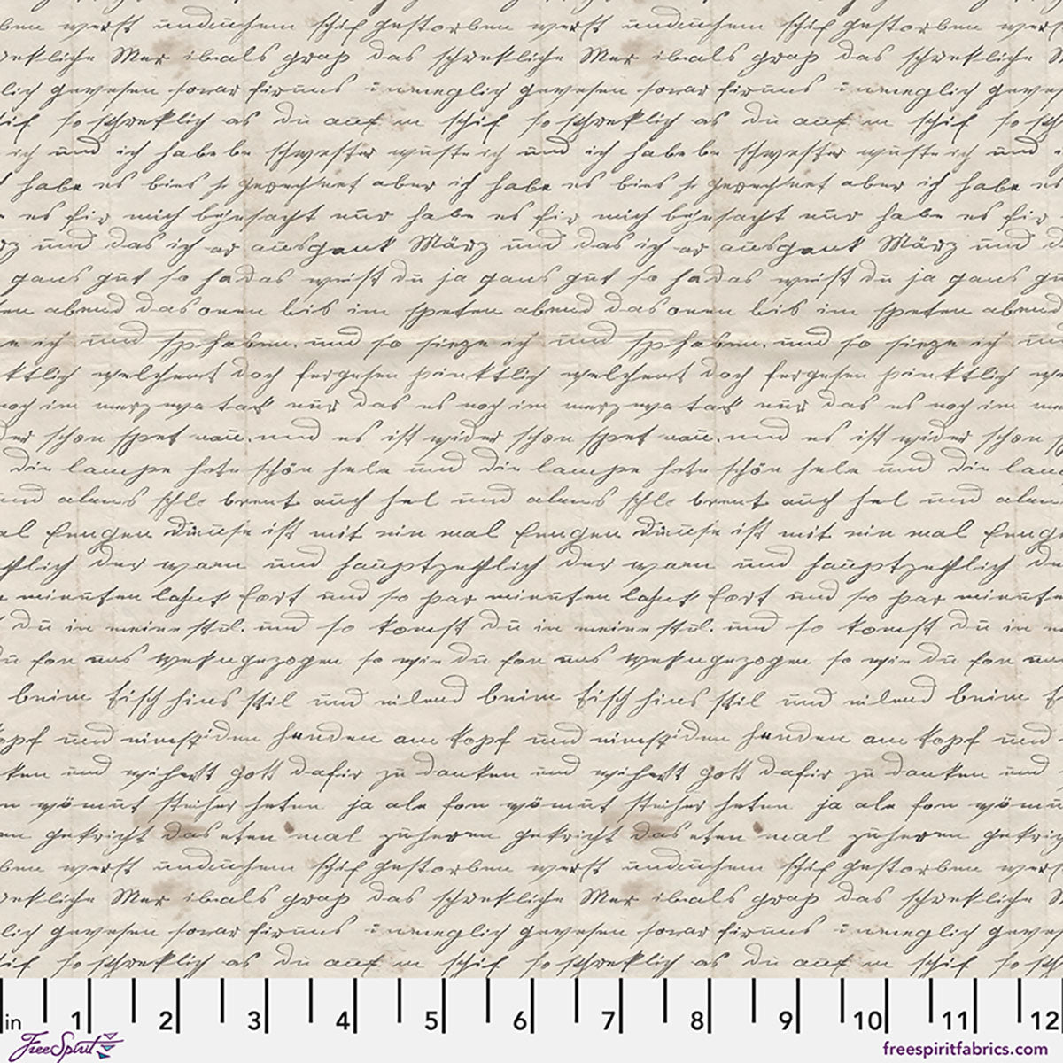 Textured fabric with handwritten-style text and a ruler at the bottom