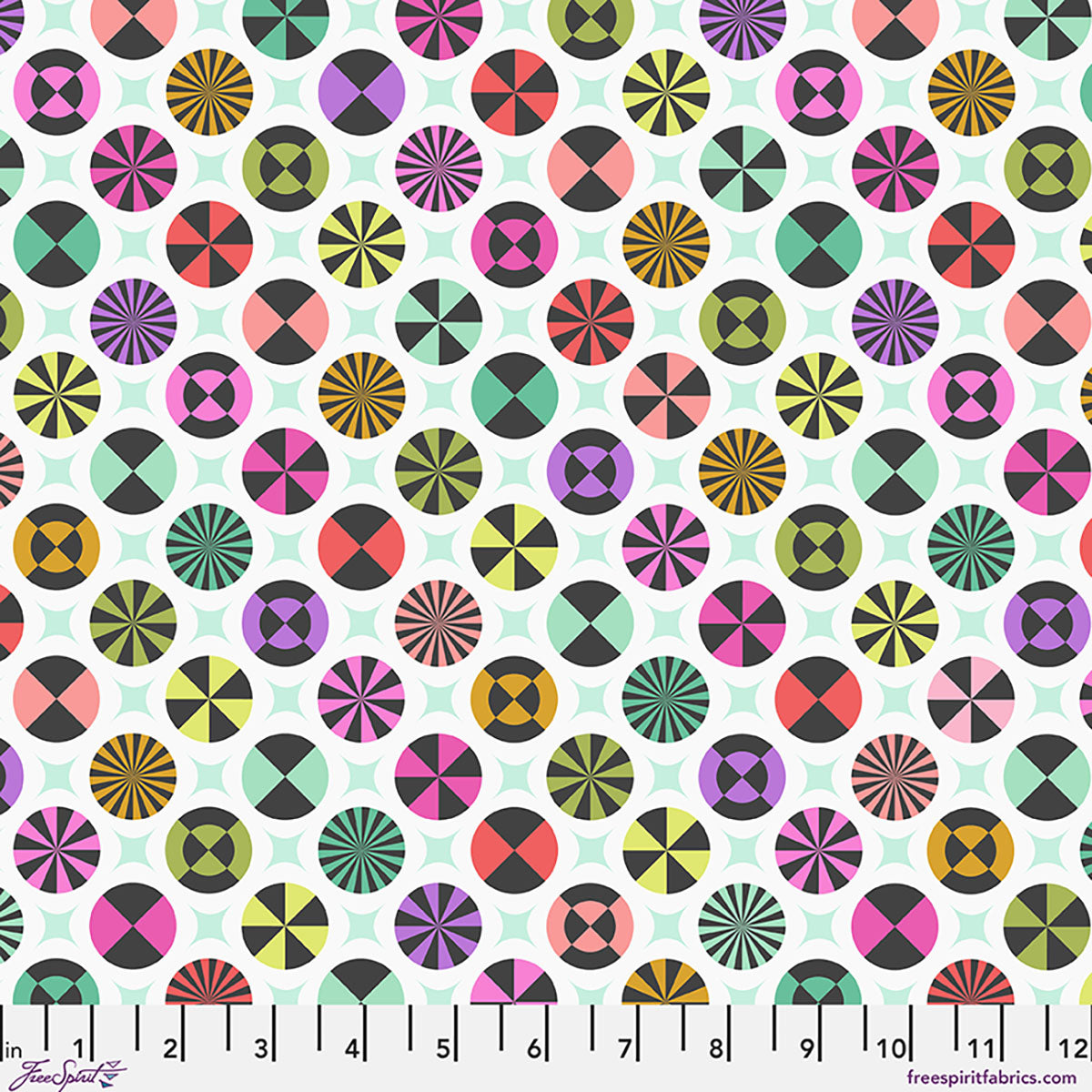 Colorful geometric pattern on a fabric swatch with a ruler at the bottom.