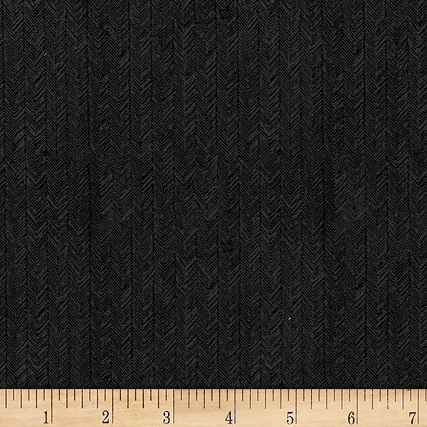 Black textured fabric with a fine herringbone pattern, shown with a wooden ruler at the bottom for scale.