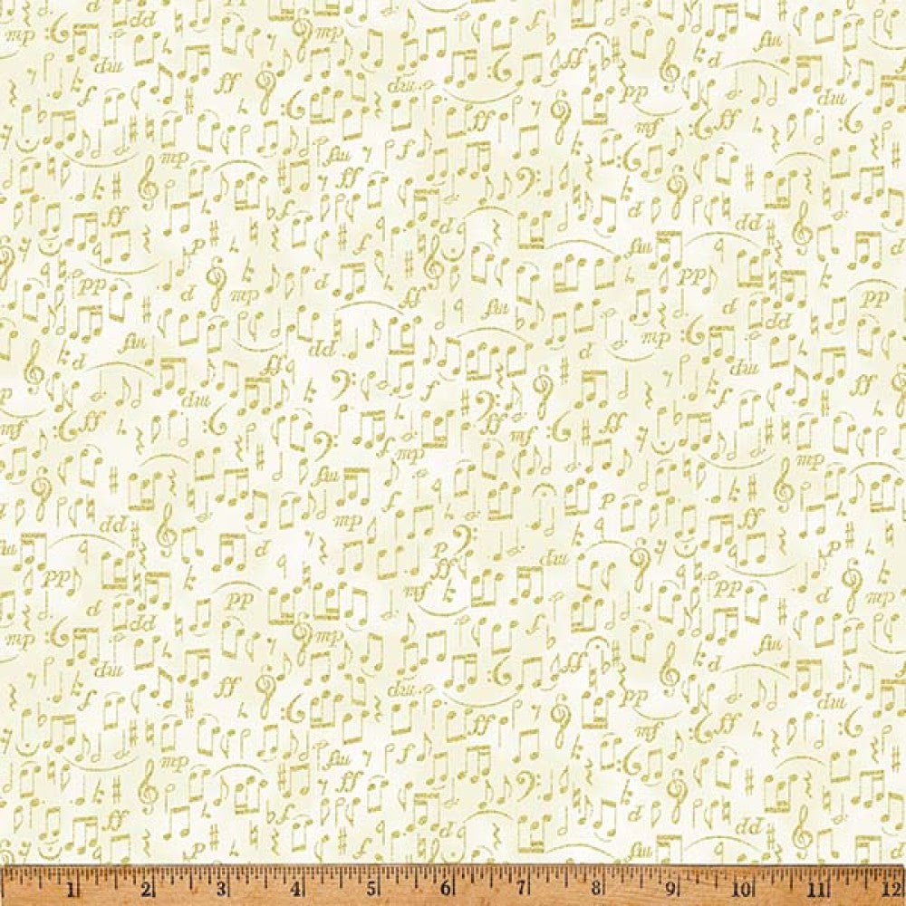Fabric with music note pattern on a beige background, ruler at the bottom for scale.