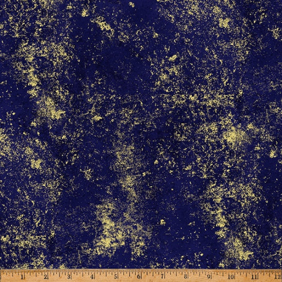 Textured blue and gold fabric with a ruler at the bottom for scale