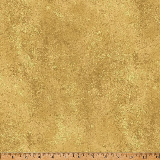Gold textured fabric with a ruler at the bottom for scale