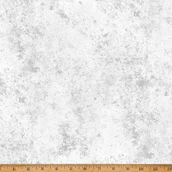 Textured gray and white background with a ruler at the bottom for scale.