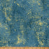 Textured blue fabric with yellow specks and a ruler at the bottom for scale.