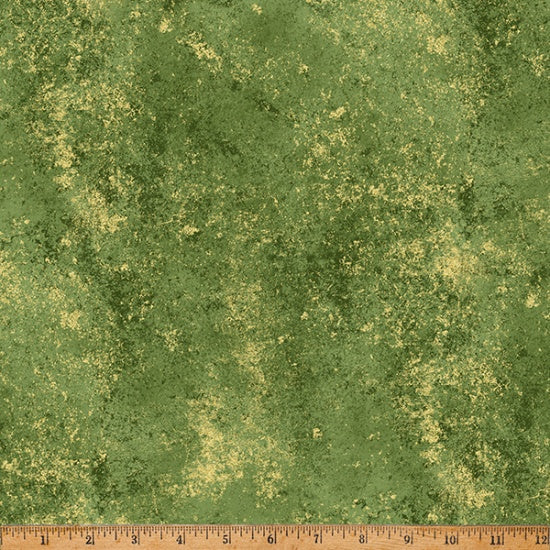 Textured green fabric with a ruler at the bottom for scale