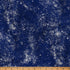 Blue fabric with white speckles and a wooden ruler at the bottom